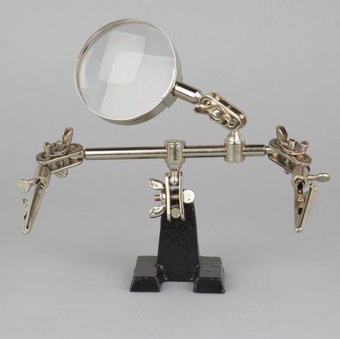 Helping Hands with Magnifying Glass